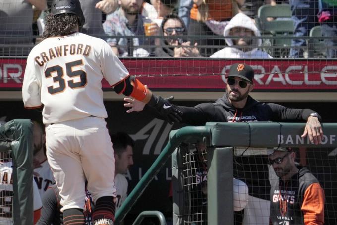 Giants beat Rockies for 10th straight, Crawford homers


