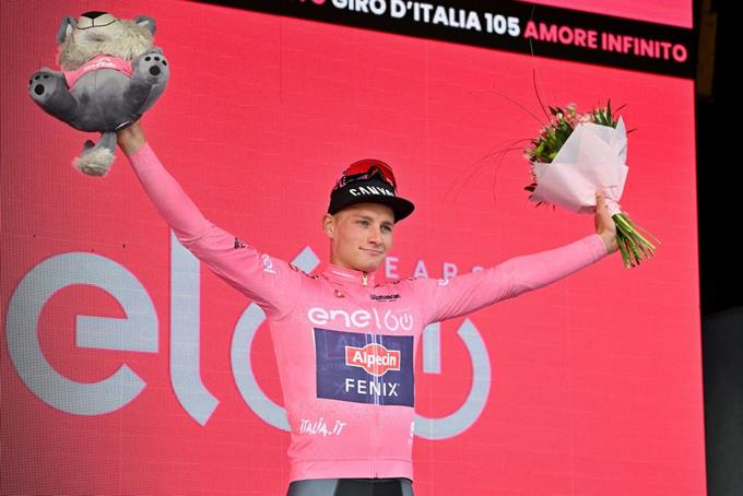 Van der Poel wears a pink jersey after winning the first stage of the Giro d'Italia

