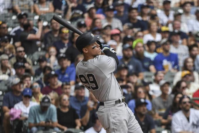 Judge hits homers 58 and 59, Yankees beat Brewers 12-8

