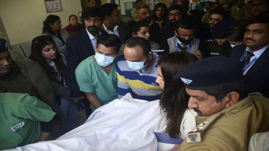 Hospital staff push a stretcher carrying Rishabh Pant into an ambulance in Dehradun 