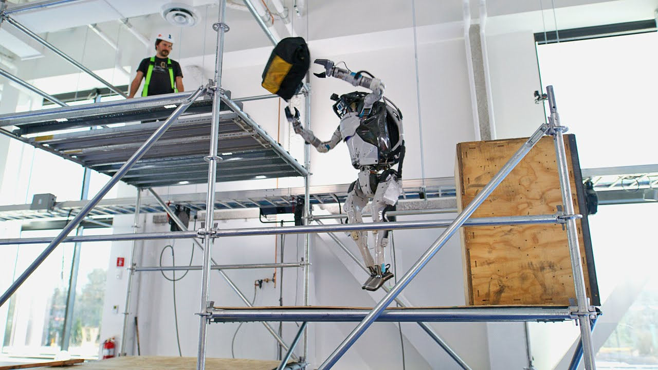 Boston Dynamics humanoid robot grabs and throws objects in its latest video


