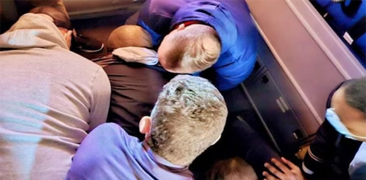 Dangerous act of passenger during flight
