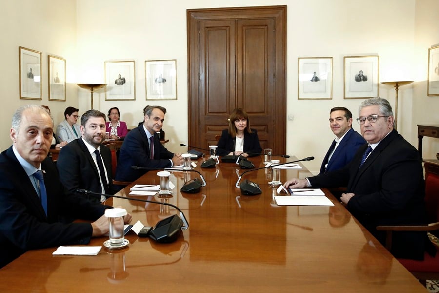 The Greek president Katerina Sakelaropoulou (C) in a meeting with the Greek Prime Minister and president of the conservative New Democracy party, Kyriakos Mitsotakis (5-l), the president of SYRIZA, Alexis Tsipras (2-r), the president of the Elliniki party Lisi, Kyriakos Velopoulos (i), the leader of PASOK - KINAL, Nikos Androulakis (3-i), and the general secretary of the Communist Party of Greece (KKE), Dimitris Koutsoumpas (d) in Athens, this May 24.