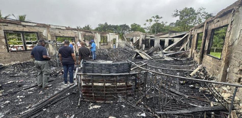 Fire that killed at least 19 at a school residence in Guyana may have been intentional
