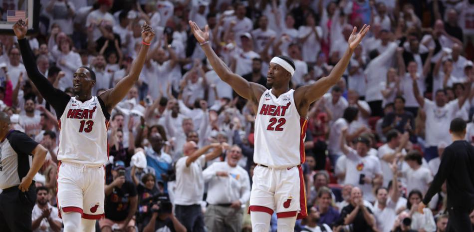 Miami moves within one win of the finals by beating Boston 128-102
