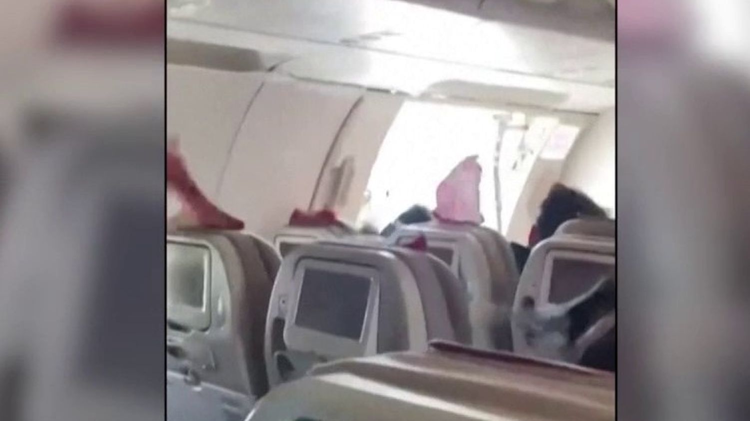 South Korea: A passenger opens the door of a plane in mid-flight

