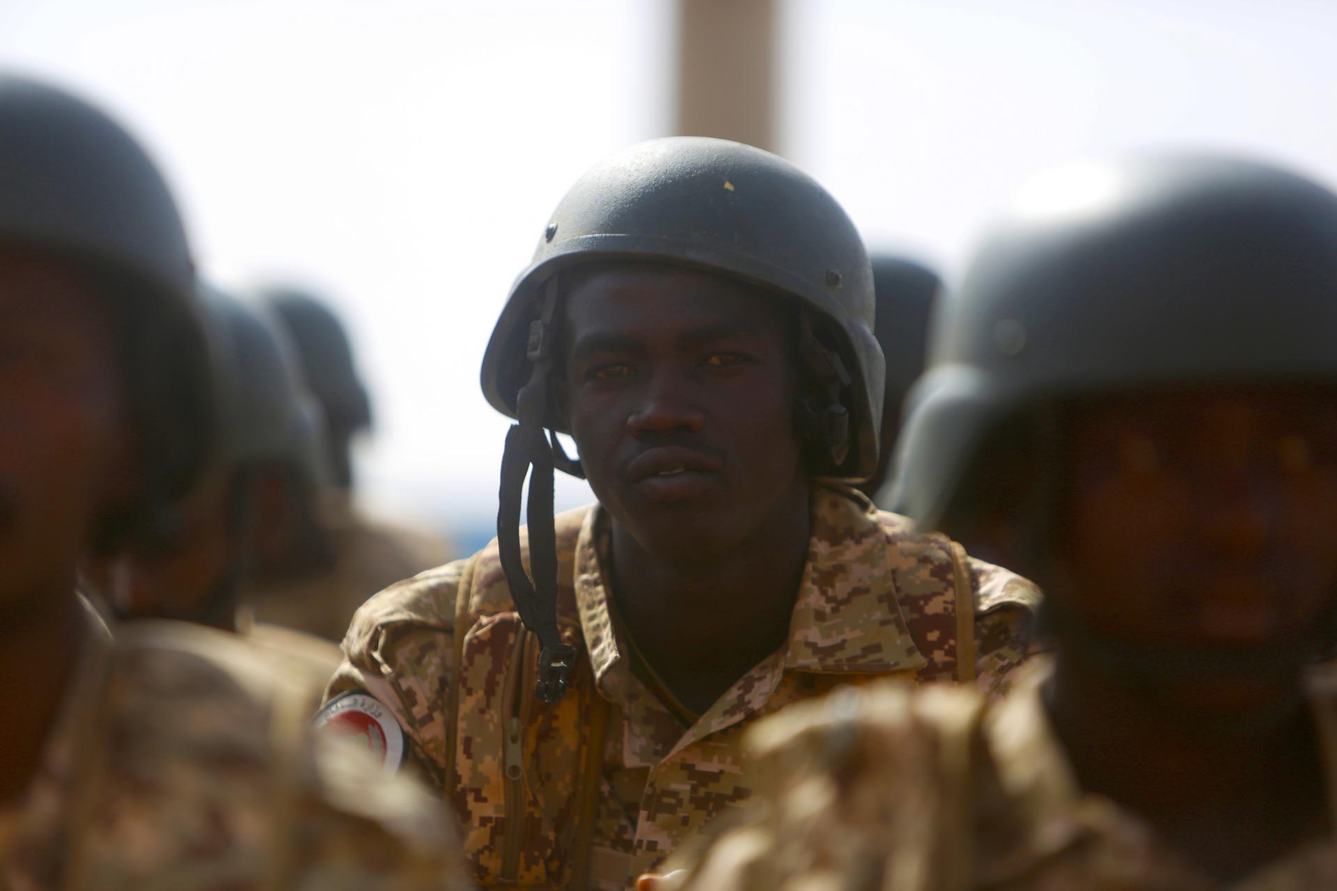 Sudanese army personnel await the start of military exercises