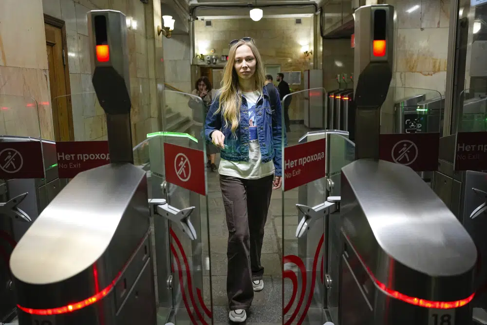 Yekaterina Maksimova, detained five times, enters a metro stop in Moscow, Russia, on May 22, 2023.
