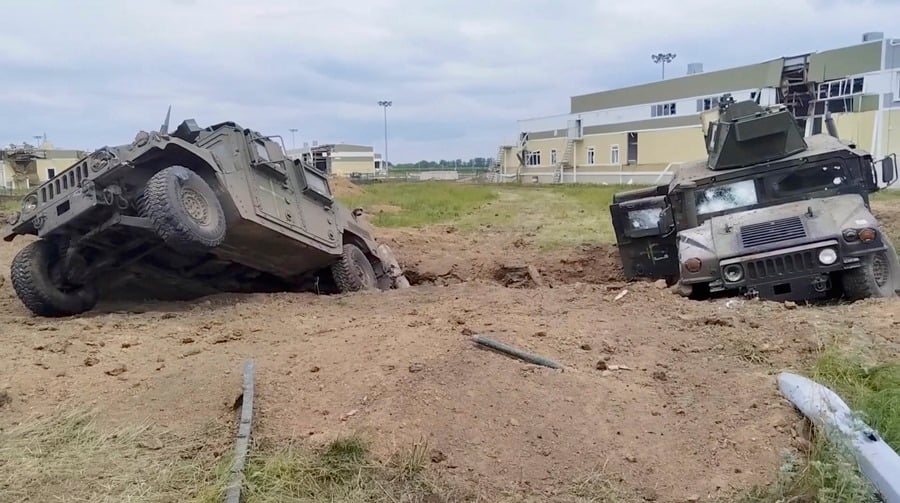 Image taken from video provided by the Russian Defense Ministry showing destroyed armored fighting vehicles in the Grayvoronsky district of Belgorod region, Russia, on Tuesday, May 23.