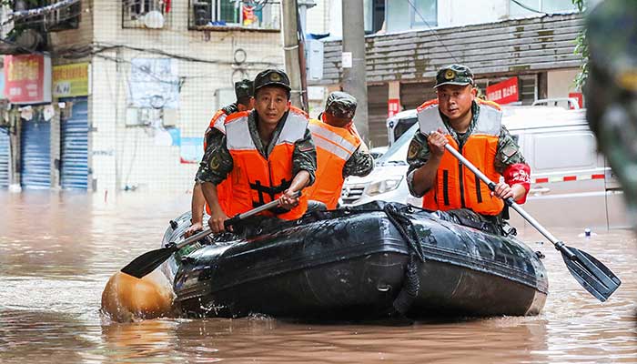 Rescue operations are underway for people trapped in the flood - AFP