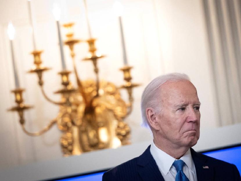 Joe Biden with a serious face in the White House.