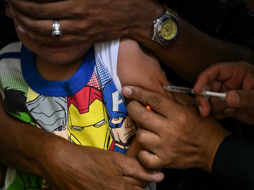 Children receiving a measles vaccination.  (AFP)