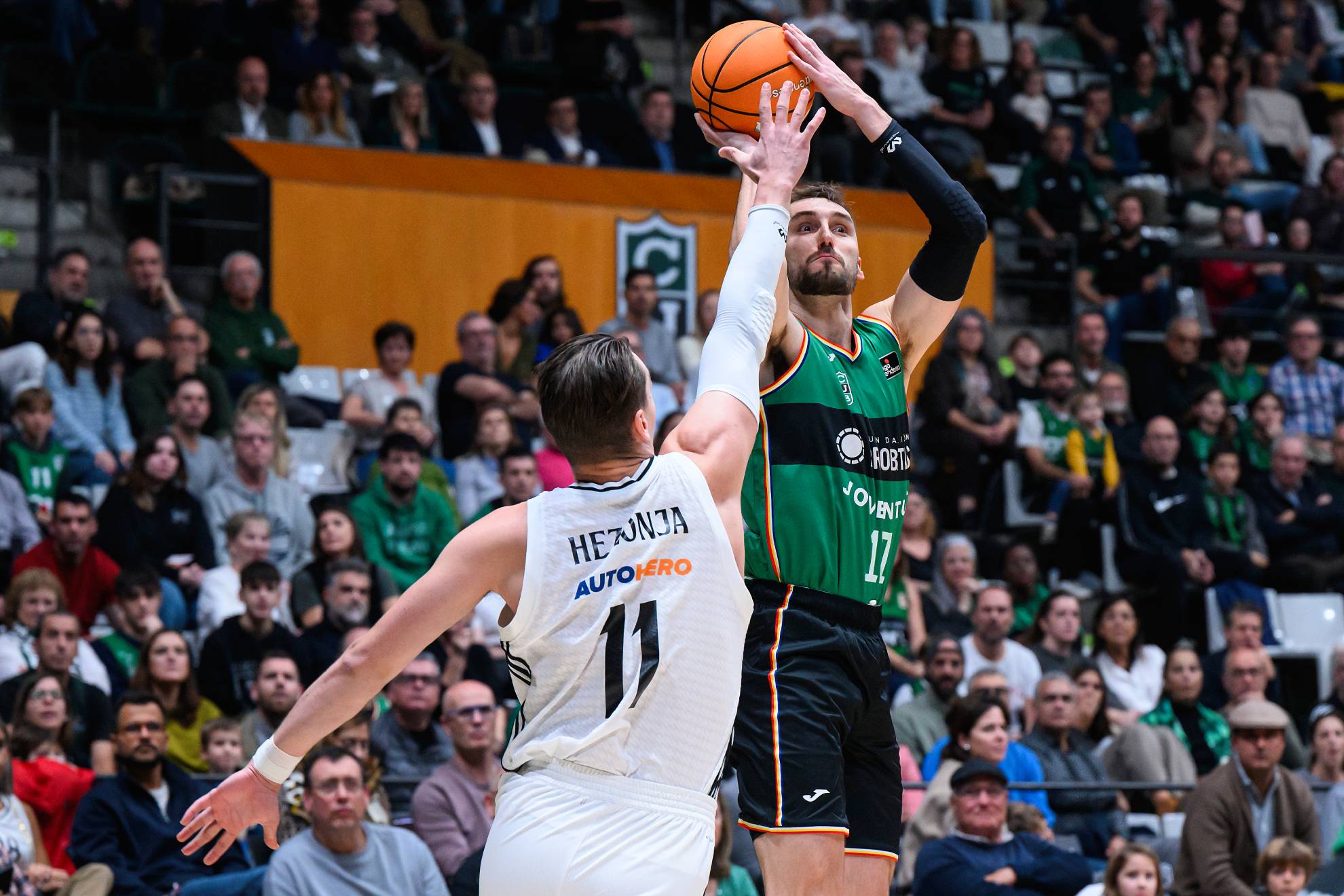 Real Madrid Eyes American Forward in Shock Transfer Move Sam Dekker shoots a triple against Mario Hezonja's defense in a recent game against Real Madrid.