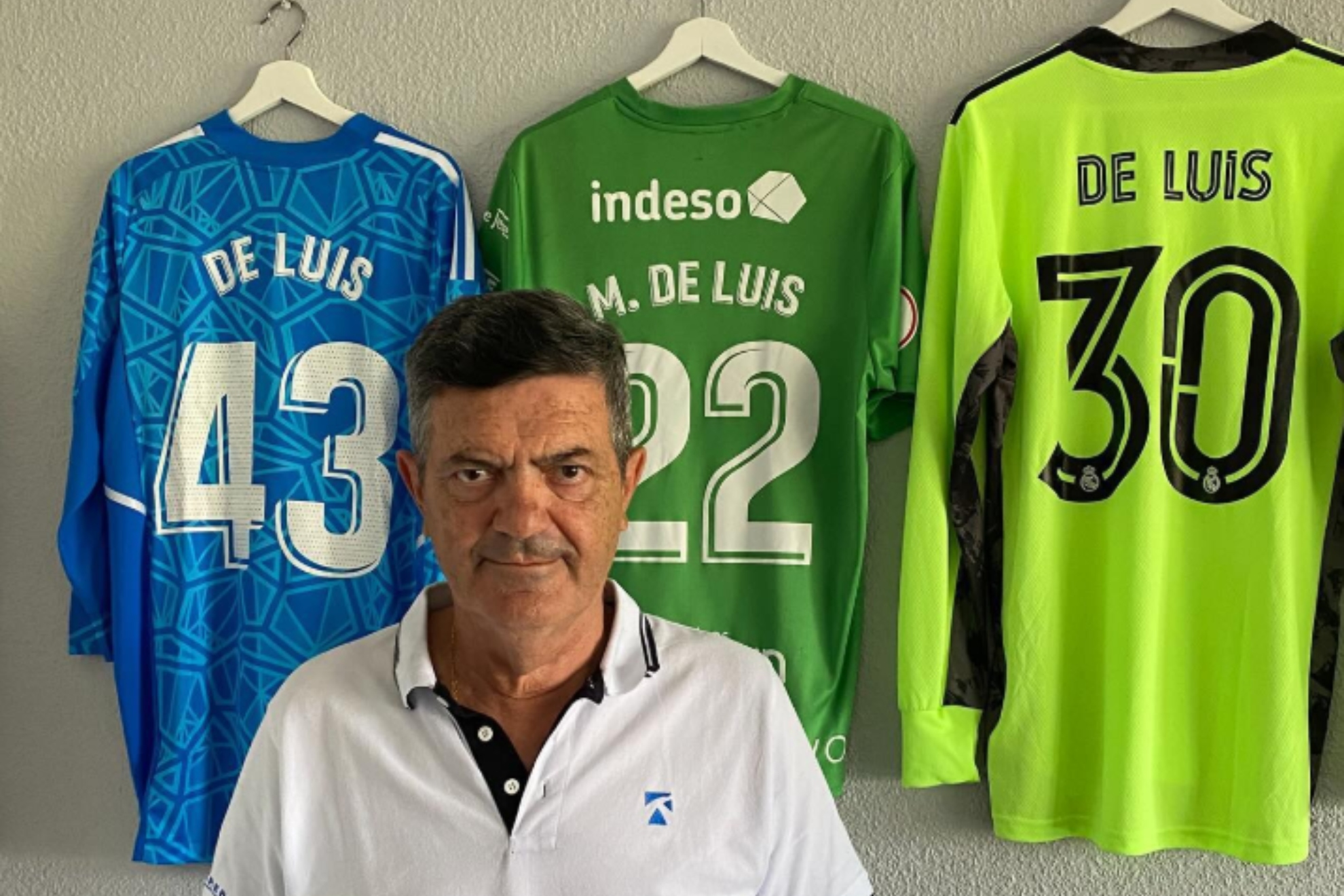 Mario's father from Luis, posing with some of his shirts.