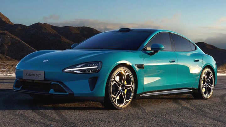 Xiaomi Electric Vehicles Conquer China; Europe Expansion by 2027 A silver electric car, the Xiaomi SU7, parked on a street with city buildings in the background.