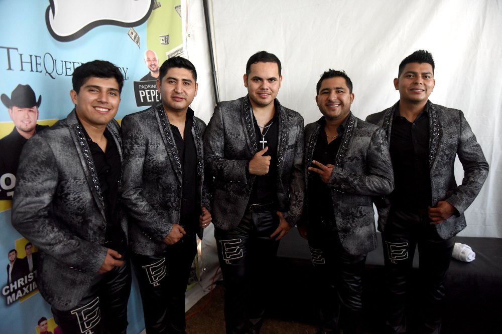 Ernesto Barajas giving a thumbs up with the group 'Enigma Norteño'.