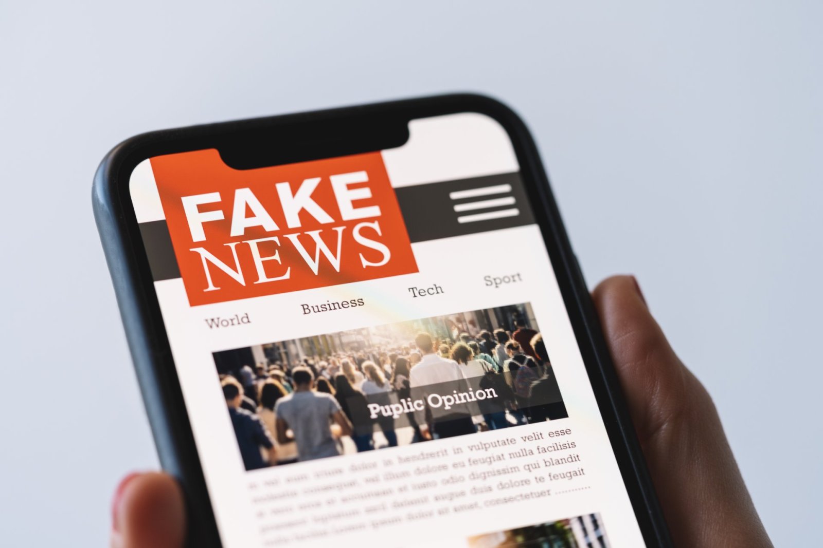 Fake News, AI Chatbots Exploit US Activist Shooting to Spread Disinformation online fake news mobile phone close up woman reading fake news hoax articles smartphone screen application hand holding smart device mockup website fake newspaper portal 1