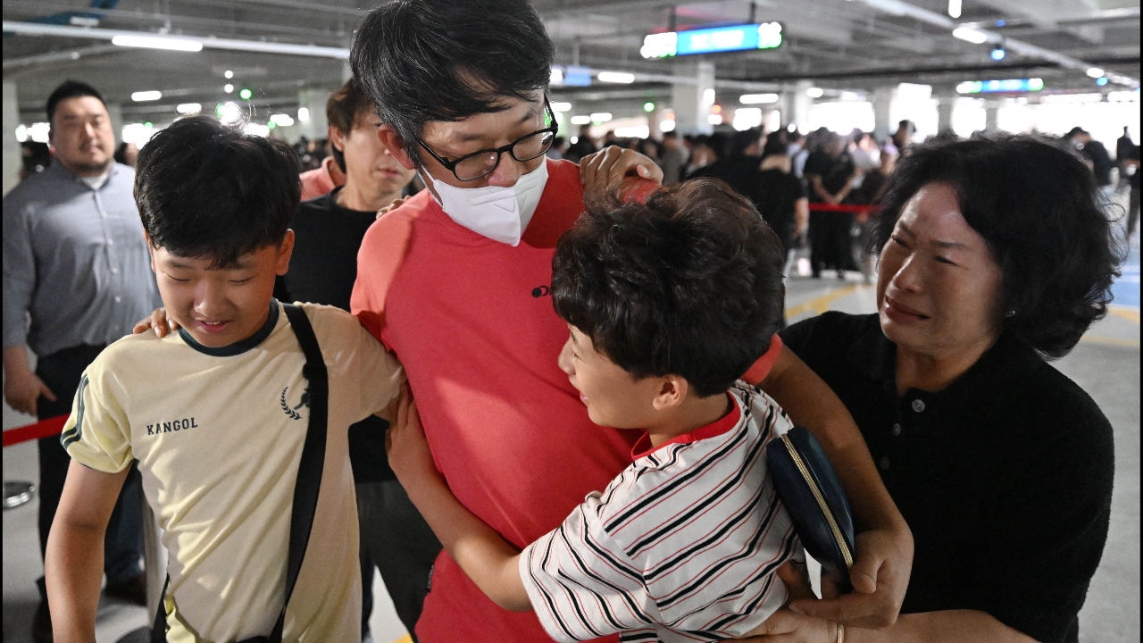 South Korean workers returning home after being swept up by the US government at a battery factory