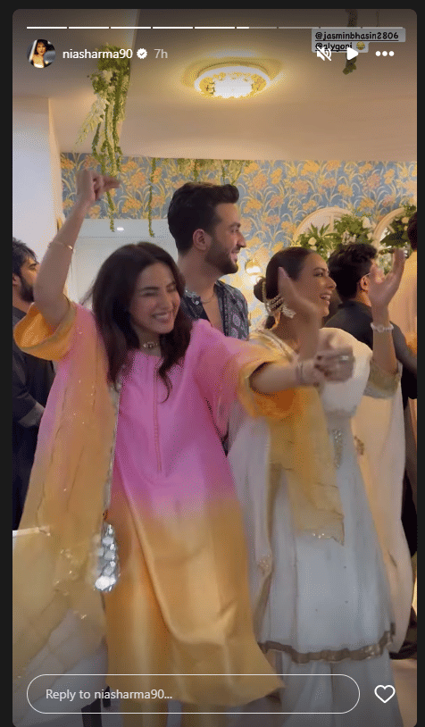 Nia Sharma and her co-stars from Laughter Chefs Fun Unlimited dancing together to a retro song.